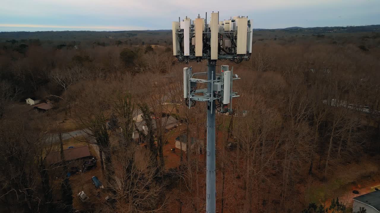 Aerial Shot Rotating Around Cell Phone Tower in Forest. 4K Drone