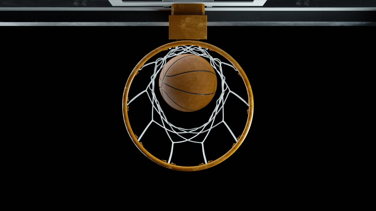 el baloncesto golpea la canasta en cámara lenta desvaneciéndose en la oscuridad