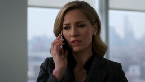 woman on a phone call in an office