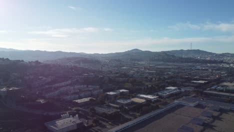 Zoom in Drone footage captures an aerial view of the Bayview district in San Francisco. The iconic Sutro Tower can be seen in the background.