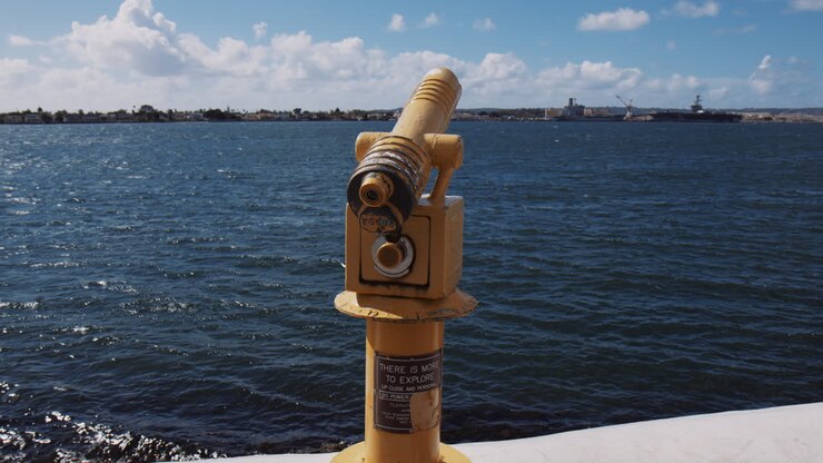 Yellow Coin-operated Telescope On The Shore Of San Diego Bay In California, USA