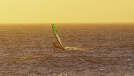 male surfer windsurfing in the beach 4k