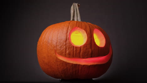 colorful flaming cheerful pumpkin, jack o lanterns, spinning on halloween