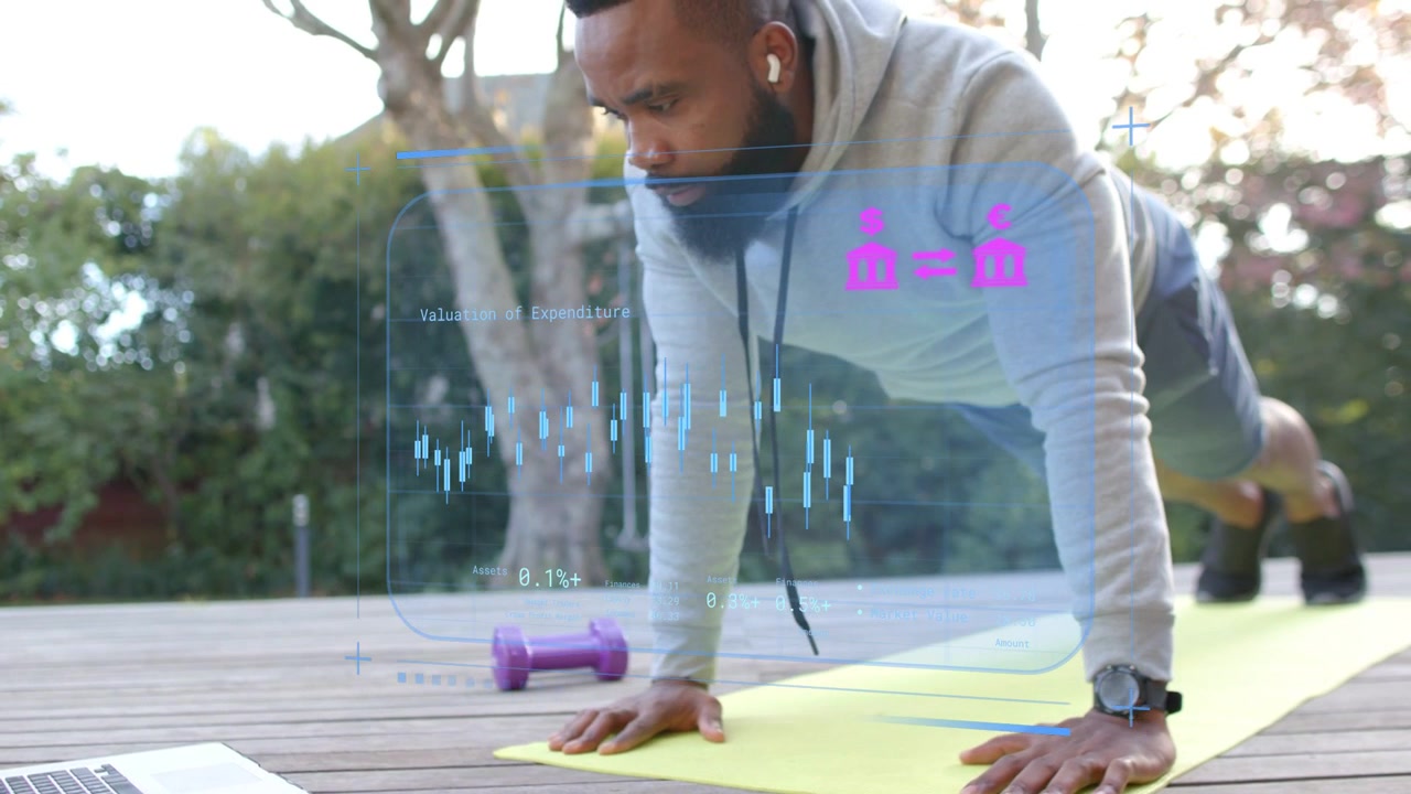 Mid-adult man performing push-ups on yellow mat, following laptop workout cue, HUD tracking metrics