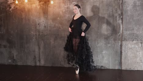 ballet dancer in black pointe shoes