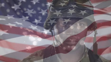 animation of flag of america waving over close up of standing african american soldier