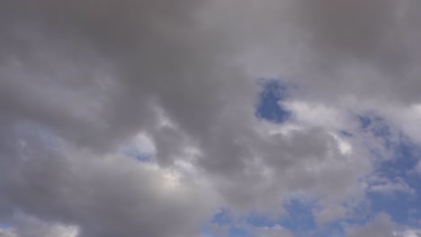 Blue-Sky-With-Dark-Clouds,-Track-Motion