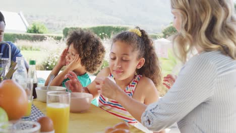 Video-of-diverse-family-spending-time-together-and-having-dinner-outside