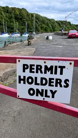 Restricted access area with parked boats visible