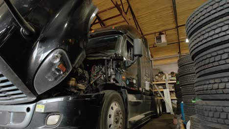 truck services repair shop. camera moves to the track in which it stands in the workshop