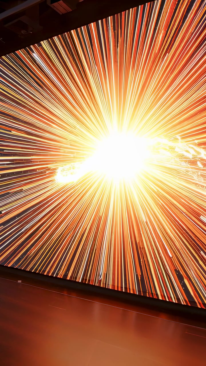 Vertical video: Surge sparking core pulsing, flaring rays and casting ribbon on gallery LED for art