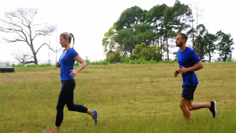 fit people jogging in boot camp 4k