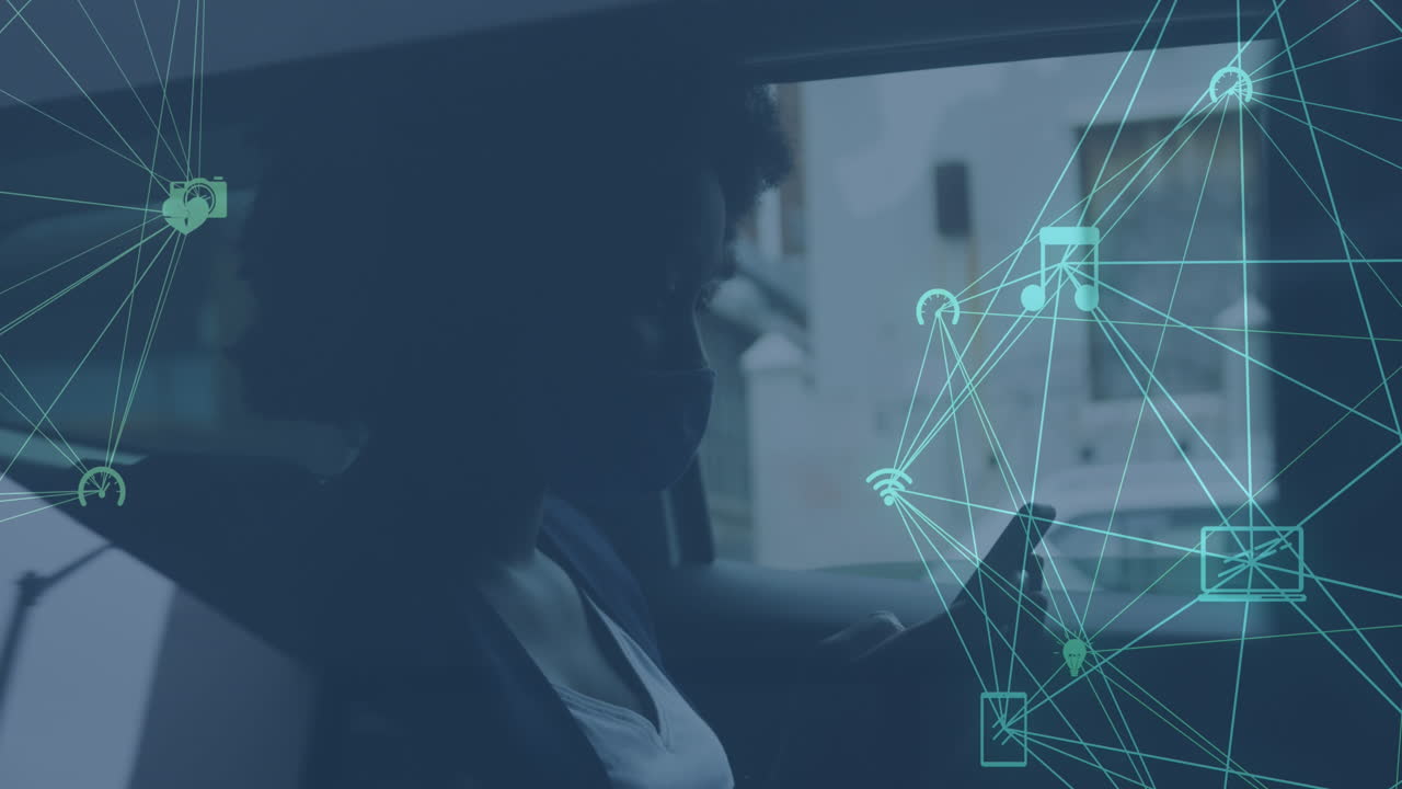 Animation of network of media icons over african american woman using smartphone in car