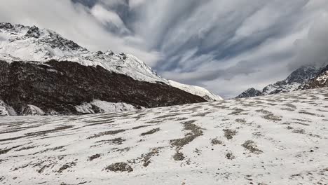 View-over-pattern-of-snow-and-glacial-moraine-plains