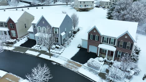 suburban homes in winter snow in united states