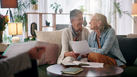 elderly couple kissing in a living room