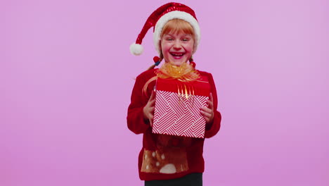 Cheerful-girl-in-sweater-Santa-Christmas-getting-present-gift-box,-expressing-amazement-happiness