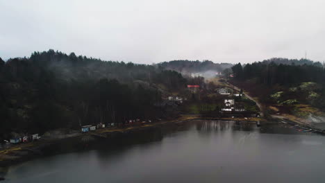 Misty-Calm-Morning-with-Swedish-Coastal-Houses,-Aerial