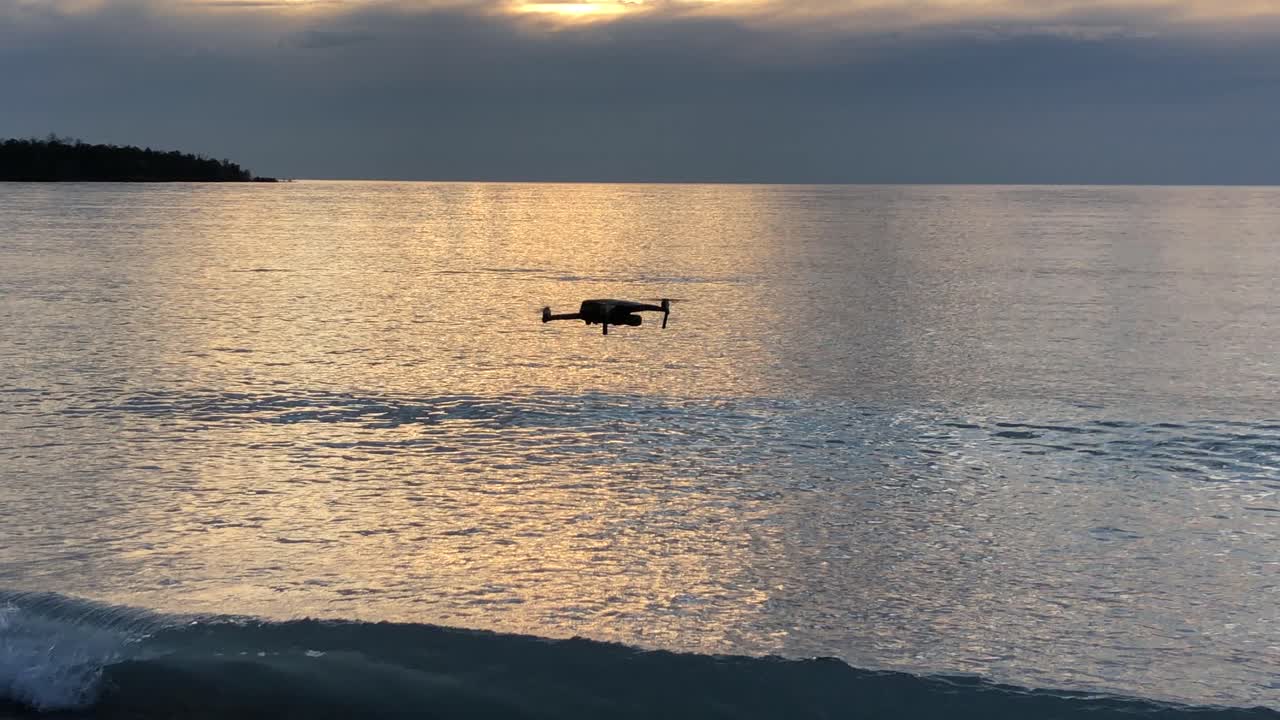 Drone flying along beach of Lake Superior in Michigan,