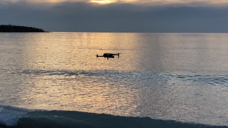 drone flying along beach of lake superior in michigan,