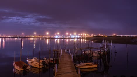 timelapse of a wooden boat dock at night