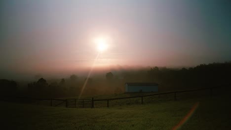 farm house in field at sunrise sliding shot