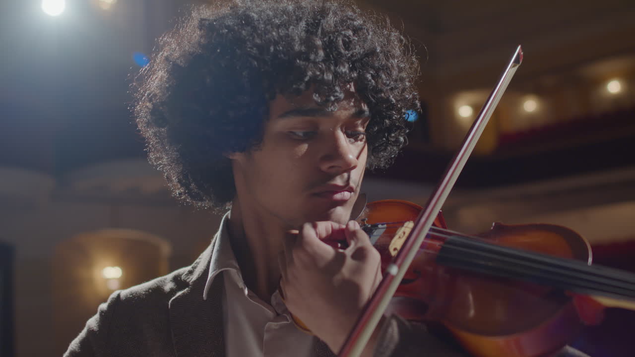 African American Violinist Playing Fiddle during Recital