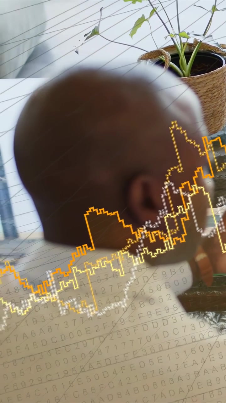 Vertical video: Seated man turning left, chin-touch, causing tech alnum grid and wave for insight