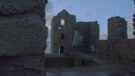 gorgeous reveal of wheal coates stone mine building in soft morning light