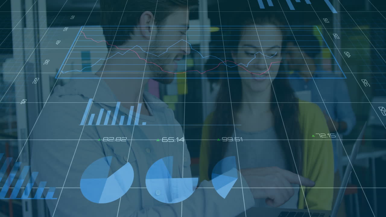 Collaborating on data analytics, business professionals analyzing graphs in office setting