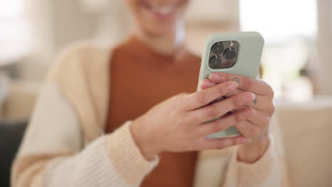 Hands,-typing-and-woman-with-phone-on-sofa