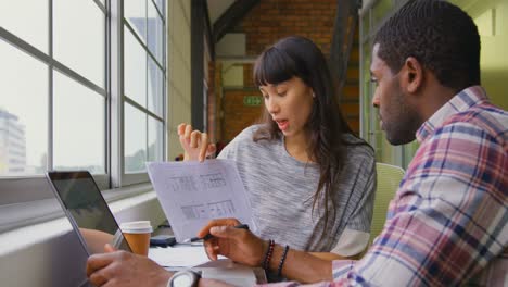 Business-people-working-together-on-a-document-in-office-4k