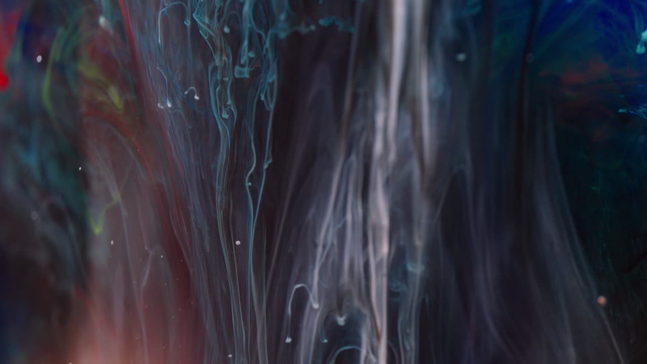 Abstract ink swirling in water with rich colors and fluid movement