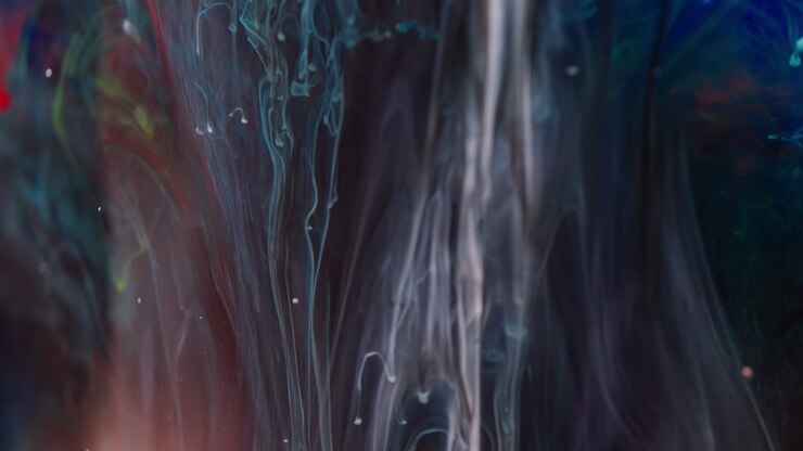 Abstract ink swirling in water with rich colors and fluid movement
