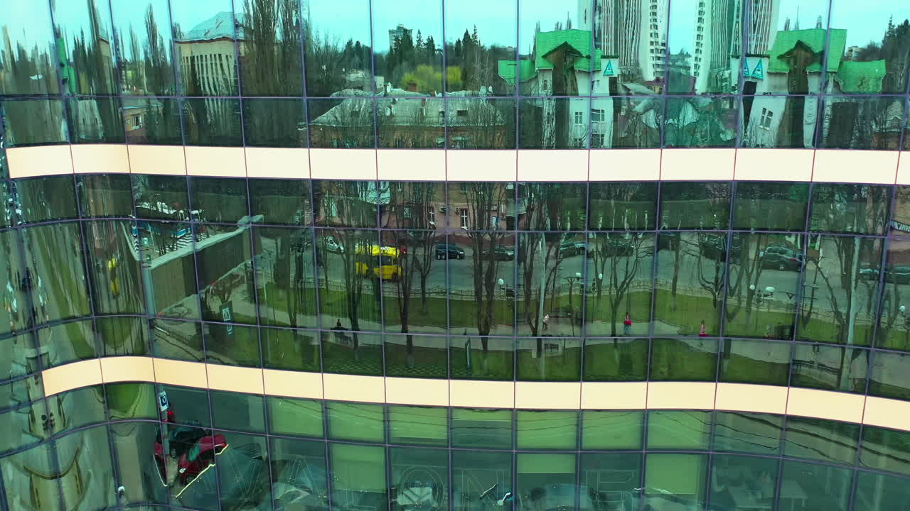 Windows of skyscraper building. Modern office skyscraper with glass windows and reflection