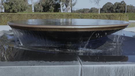 Closeup-Water-Cascading-Over-Fountain-Bowl