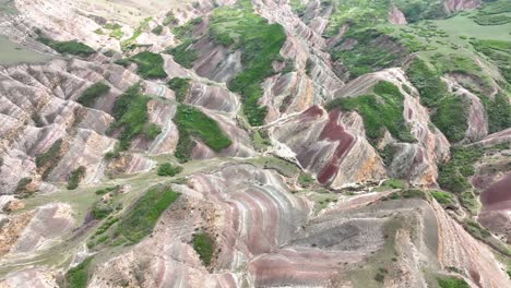 colorful rainbow mountains near udabno in georgia - aerial drone shot