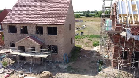 traversing left to right view showing different stages of construction on new build homes