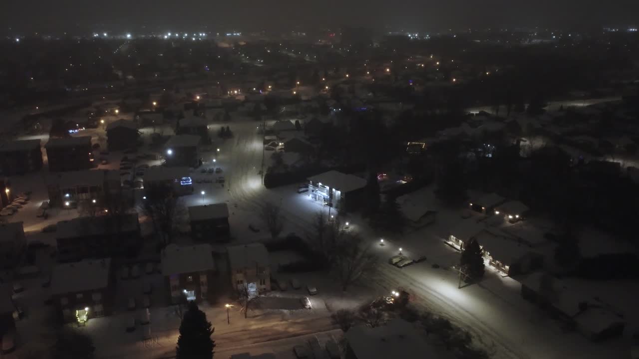 Aerial Night View of Snowplowing in Suburban Toronto Neighborhood