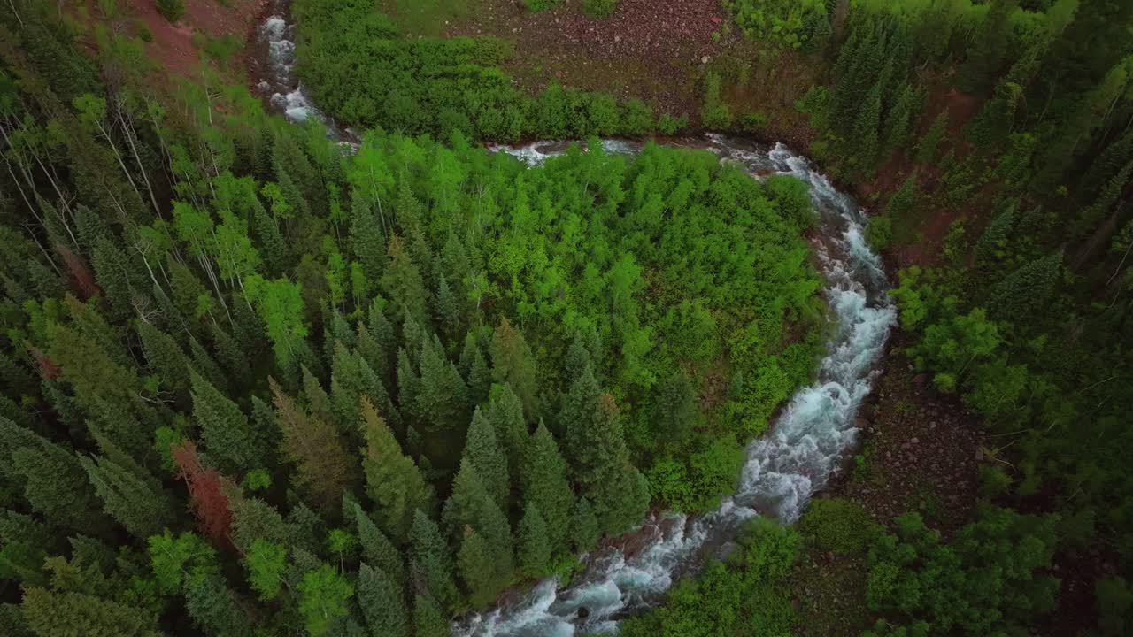 Aspen Snowmass Maroon Creek Roaring Fork Colorado River Maroon Bells Wilderness Rocky Mountains Colorado aerial drone spring summer windy curves White River National Forest afternoon forward pan down