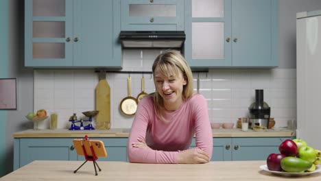 woman eating breakfast while making a video blog