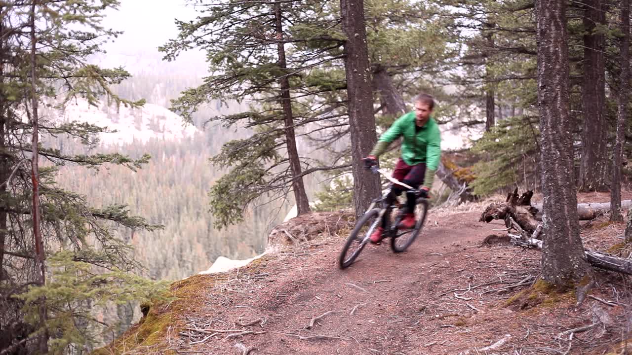 Biker riding on trail on a cloudy day