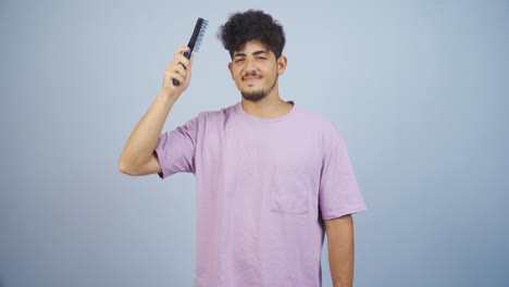 man combing his hair.