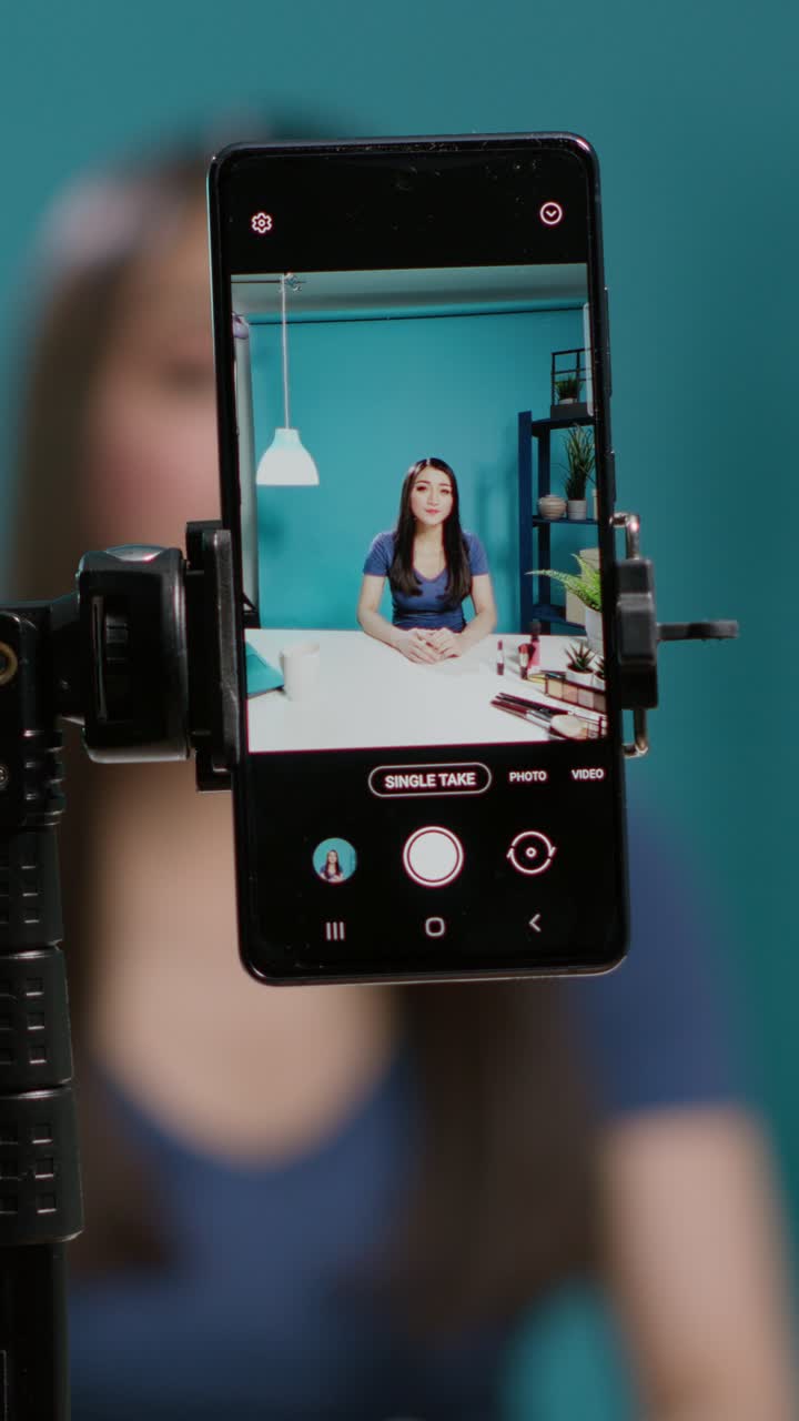 Smartphone recording a makeup tutorial vlog