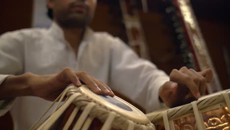 man playing tabla