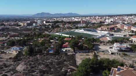aerial approach of the municipal soccer stadium in crevillente, spain
