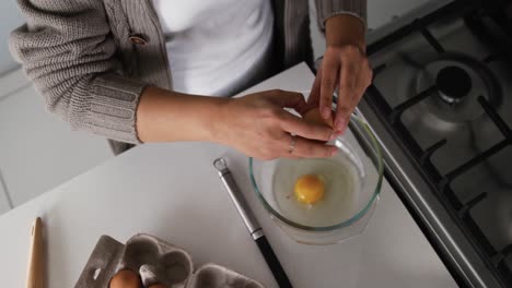 woman cooking food in kitchen