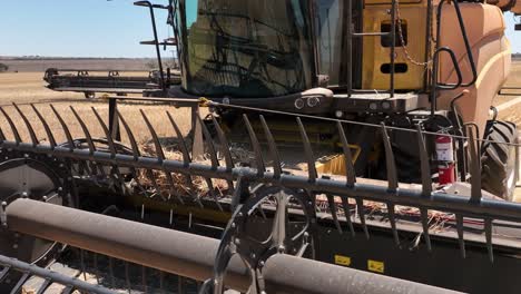 This-footage-captures-the-synergy-of-modern-agricultural-technology,-showcasing-the-essential-role-of-header-fronts-in-the-wheat-harvesting-process