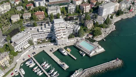 Aerial-View-Of-Hotel-Admiral-And-Moored-Boats-At-Marina-On-A-Sunny-Day-In-Opatija,-Croatia