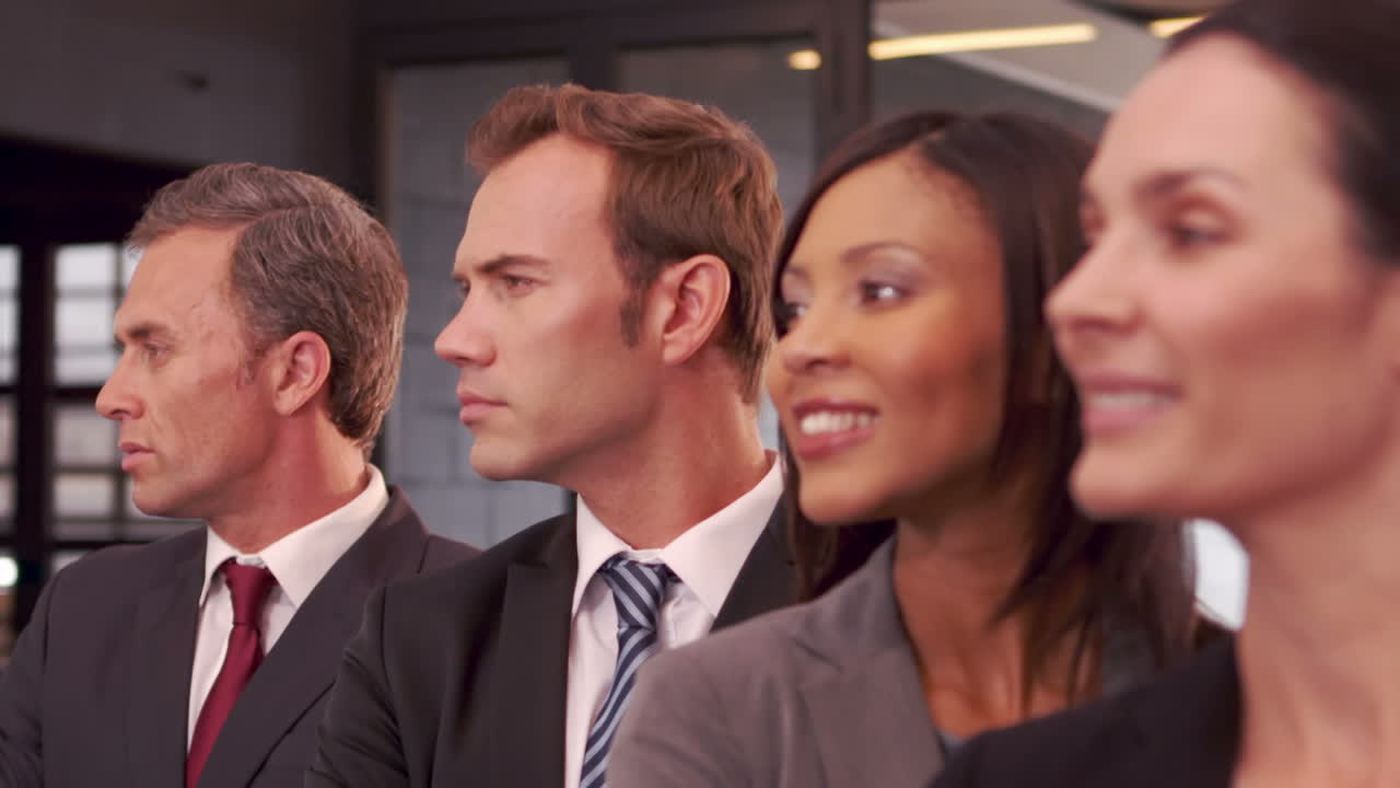 Smiling business people posing together 